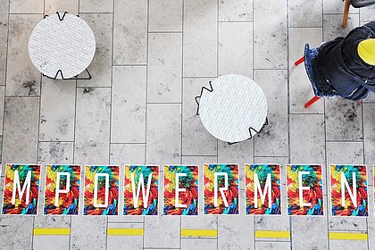 the word "empowerment" on the floor at the cafeteria