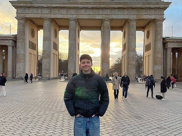 Spanish ERASMUS student Víctor del Amo Higueras poses in front of the Brandenburg Gate